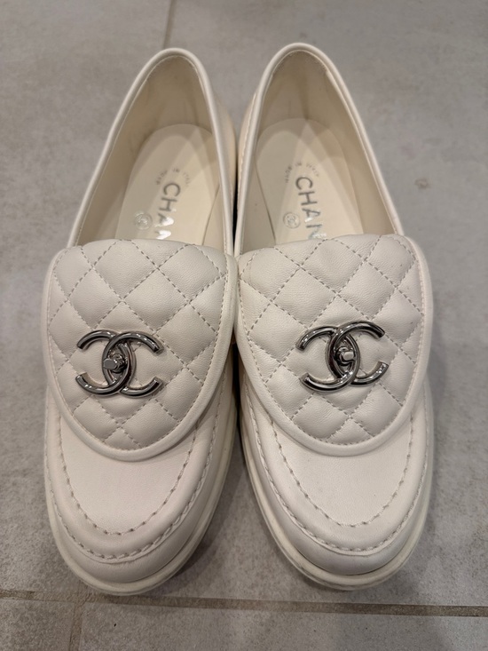 CHANEL Shoes - CHANEL Ivory Quilted Leather Loafers with Silver CC Emblem